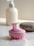 Norevella ScalpFlow silicone scalp brush in premium hair-care setting